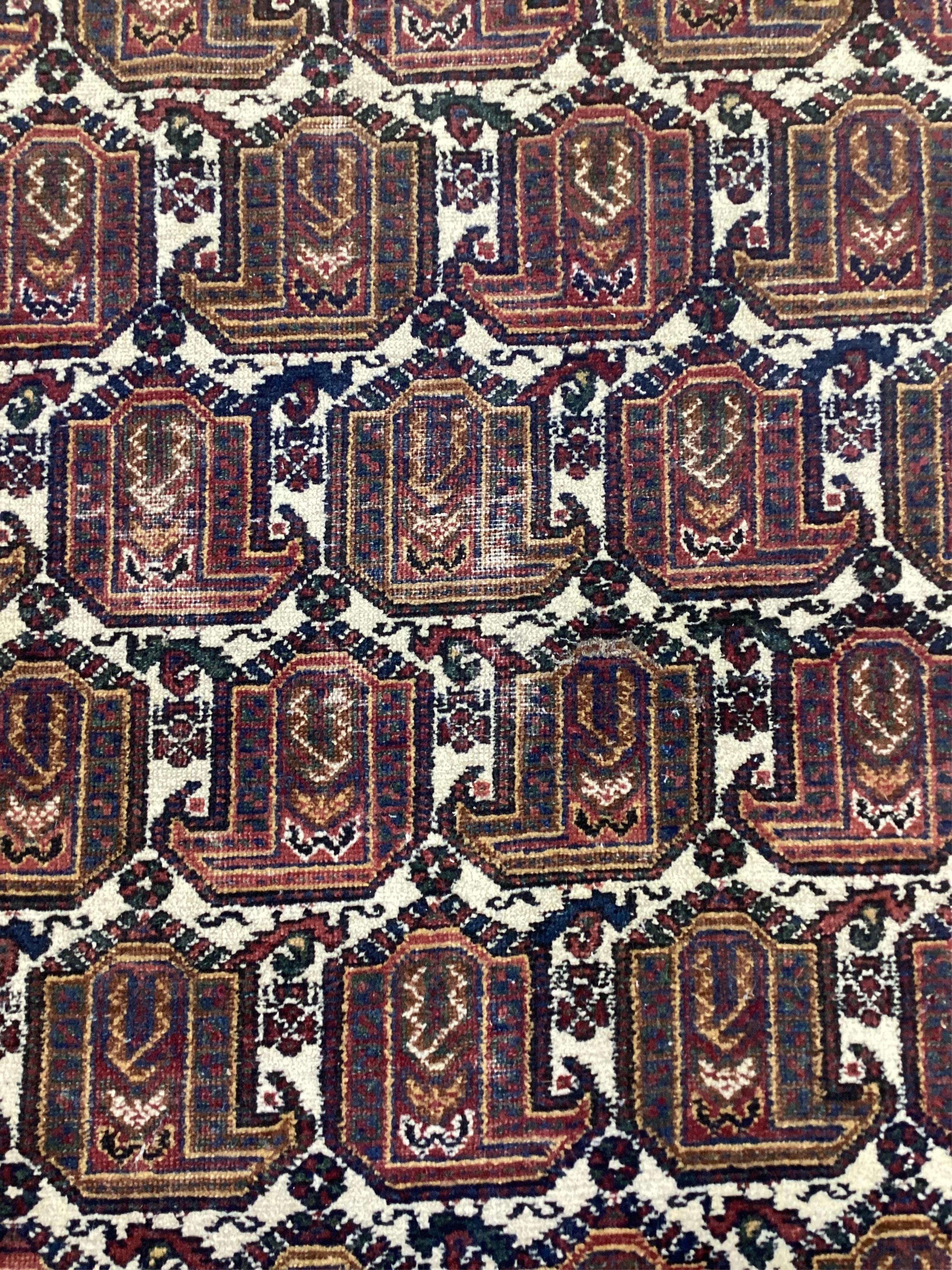 An Afshar ivory ground rug, 200 x 156cm. Condition - fair